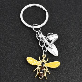 Silver gardener keyring bee shovel watering can