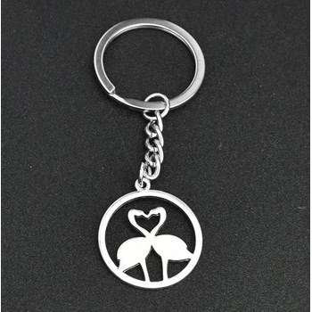 Keychain with pink flamingos forming a heart in a silver circle