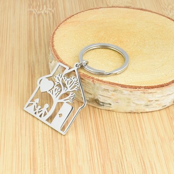 Openwork steel key ring house tree heart and family